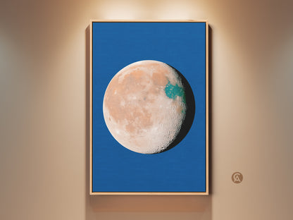 Abstract planet art print in a wood frame. This celestial moon decor features a blue background. The orange and teal space wall art has a surreal minimalist bedroom art style. Makes a great gift idea.