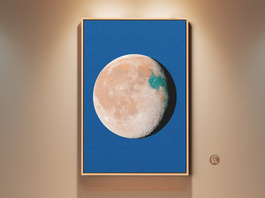 Abstract planet art print in a wood frame. This celestial moon decor features a blue background. The orange and teal space wall art has a surreal minimalist bedroom art style. Makes a great gift idea.