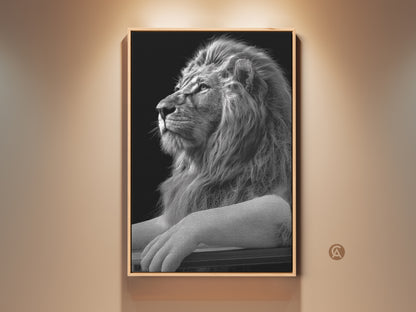Framed monochrome lion art print displayed in a well lit room. This black and white wildlife wall art adds regal elegance to any space. A perfect gift for lion lovers looking for study or office decor.