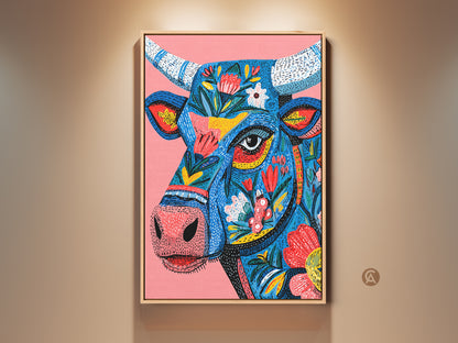 Framed floral bull artwork hangs on a beige wall. This vibrant animal art features a blue bull with colorful flower patterns. The wooden frame adds a touch of rustic charm. Perfect for adding a pop of color to any room. Shop now for unique animal art prints.