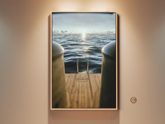 Experience nautical luxury with this contemporary art print. A yacht ladder descends into the ocean. The sunset adds a touch of gold. Perfect as coastal wall decor or a unique housewarming gift. The artwork brings serene ocean views indoors.