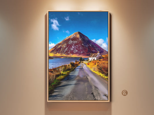 Framed white cottage landscape canvas art featuring a mountain road scenic print. This nature photography wall decor captures a rural scene with a blue sky and lake. Ideal gift for outdoor lovers adding rustic farmhouse charm to any home. The frame enhances the artwork's natural beauty.