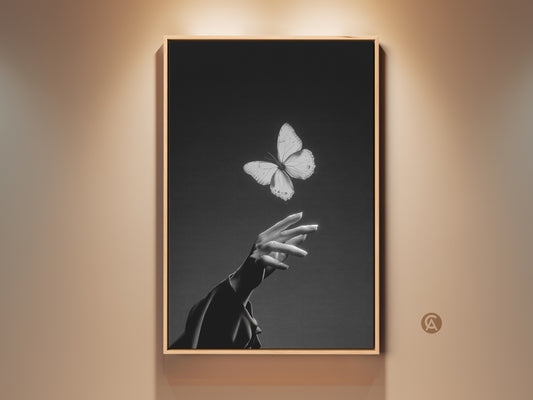 Minimalist black and white butterfly art print. This canvas features an insect interacting with a human hand. Contemporary artwork is perfect for bedroom or living room decor. A thoughtful gift for nature lovers. Add elegance to any space