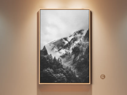 Framed foggy mountain forest canvas print. It's a monochrome landscape wall art piece. The black and white nature scene adds modern home accent. Perfect housewarming gift art.