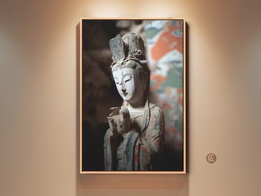 Vintage Guan Yin art on canvas in a room setting. The traditional Asian artwork brings a spiritual touch to eclectic home decor. The canvas art features white orange and teal tones. Perfect for a study room or meditation space. A unique housewarming gift for art and spirituality lovers.