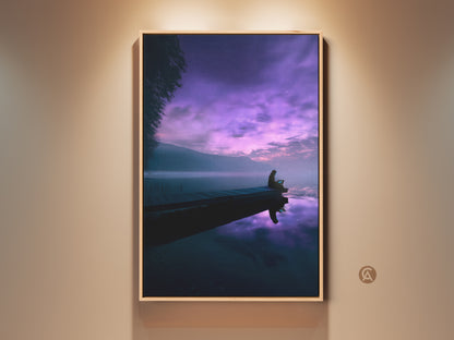 Dreamy lake canvas art featuring a person on a dock under a violet night sky. The deep blue lake and cosmic sky wall decor create a minimalist aesthetic. This surreal night view print is a unique travel gift or housewarming canvas art.