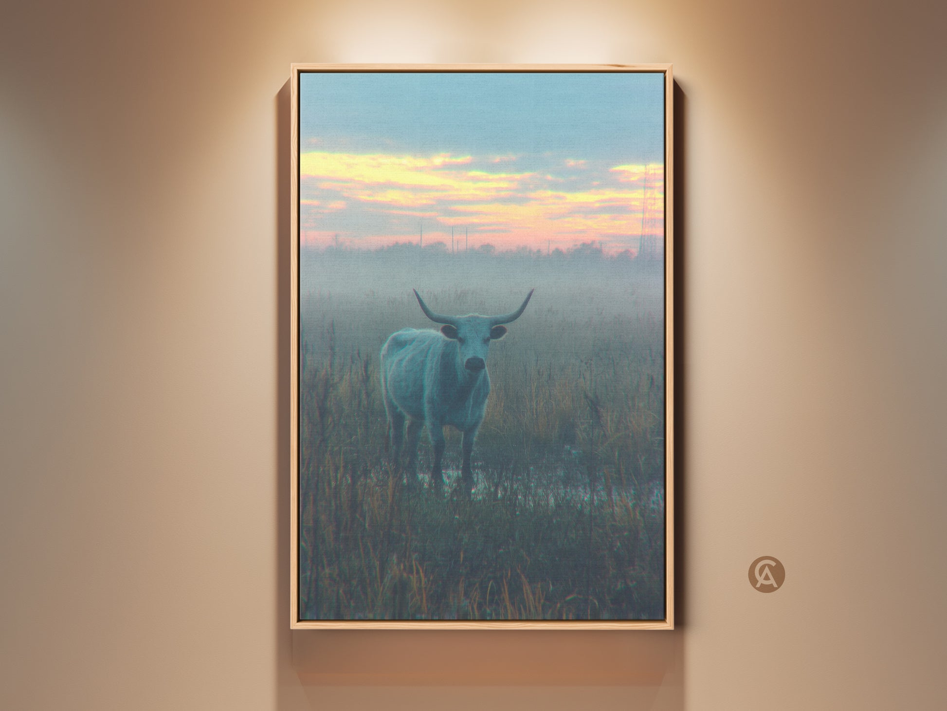 Framed fine art print of a longhorn bull in a misty field at sunrise. This captivating artwork is ready to hang. The golden frame enhances the rustic charm of this animal portrait wall art.