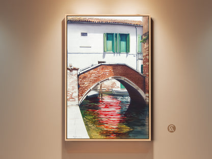 Watercolor Venice Canal artwork showcases a red brick bridge reflecting in the water. This traditional cityscape art print adds European charm to any room. A perfect housewarming gift for art lovers and travelers.