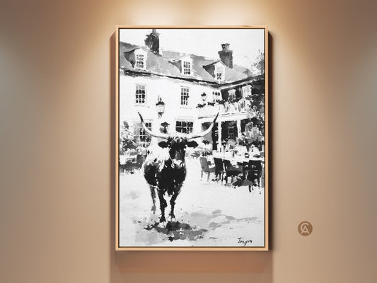 Monochrome longhorn artwork. This canvas art captures a black and white longhorn. The art is set against a building backdrop. Perfect wall decor for rustic art lovers. The framed canvas adds a touch of sophistication. The artwork enhances any room's aesthetic appeal. Buy this unique wall art today.