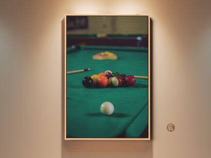 Framed pool table canvas art displays billiard balls in emerald green tones. This photorealistic man cave decor adds leisure to any space. A perfect sports gift for pool players. The billiard balls print captures a cinematic essence suitable for bar area wall decor.