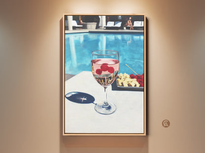 Contemporary canvas art features a glass of raspberry rosé poolside. Aqua and pink hues create a refreshing summer vibe. Perfect wine lover gift adds chic style to dining or bar decor. This modern lifestyle wall art captures leisure and elegance.