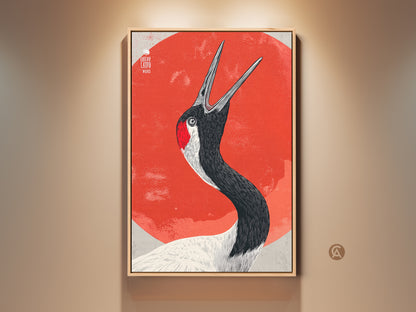 Framed Red Crowned Crane art print against a vibrant orange sun in a gallery setting. This Modern Folk Art poster is perfect for nature decor in a living room or bedroom. The crane's details & striking colors create a unique piece of wildlife wall art.