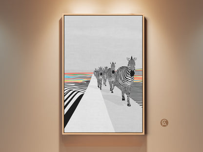 Framed abstract zebra canvas art is on display. The black and white zebras are walking through a striped landscape. The eclectic blend of geometric patterns and animal subject creates a unique look. This modern graphic wall decor adds color to any room. It is the perfect addition to your contemporary home