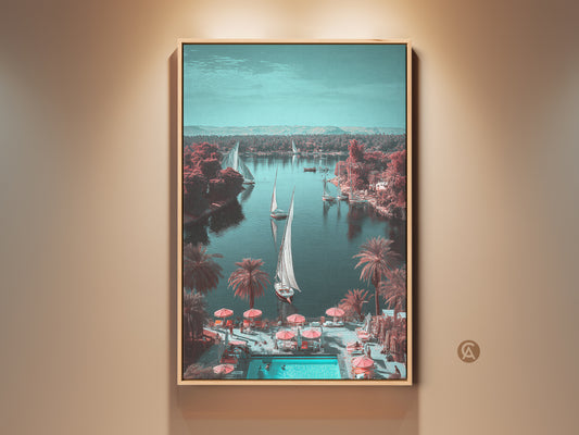 Vintage sailboat canvas art showcasing a retro travel landscape print. Teal blue nautical wall art adds a boho coastal element to home decor. Sailing boats are featured on a serene river with palm trees. This scenic print evokes a vacation vibe ideal for nautical themed home decor. The unique landscape canvas makes a thoughtful housewarming gift for the traveler.