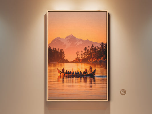 Framed canvas artwork featuring a pacific northwest canoe scene. The artwork shows a canoe with people on a lake. A snow-capped mountain and forest are in the background. Warm sunset colors fill the sky. This framed wall art brings nature indoors.