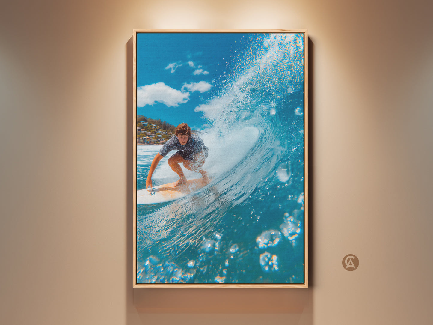 Surfer artwork on canvas. A man rides a wave in a wooden floating frame. The ocean wave curls above him. Bubbles rise in the foreground. A coastal community is visible in the background. This surfing wall art brings the ocean to any room.