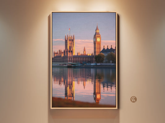 Houses of Parliament and Big Ben artwork. Golden hour bathes the London cityscape in a warm light. See the stunning reflection shimmering on the River Thames. A perfect travel themed wall decor for contemporary homes.