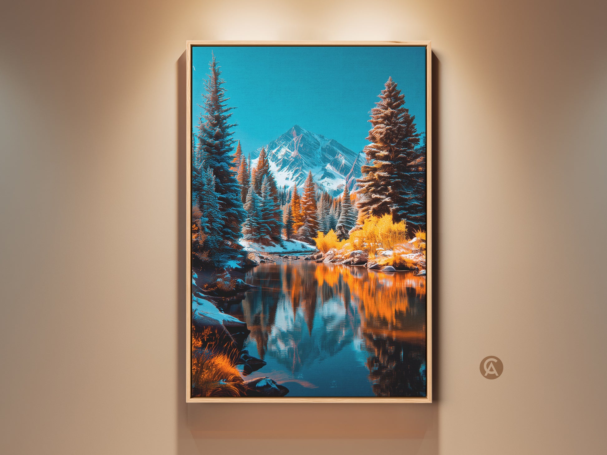 Gallery artwork of a winter mountain scene. See the snow capped mountain reflecting in a calm lake. Pine trees line the shore. The artwork is framed in a natural wood frame. This framed art is the perfect addition to your home decor.