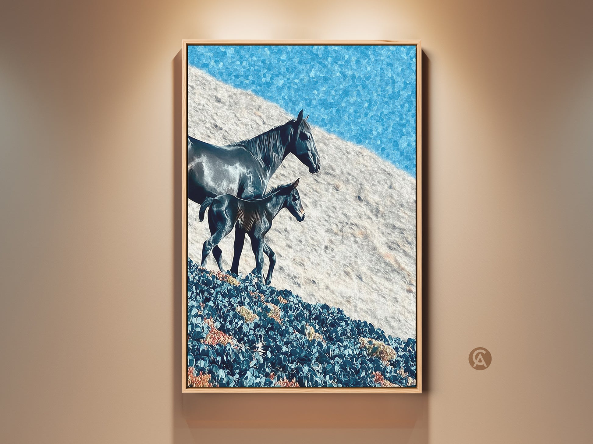 Framed rustic horse and foal canvas art is displayed. The impressionistic landscape wall art features a deep blue sky. This equestrian gift is perfect for bedroom decor. Light illuminates this eye-catching artwork.