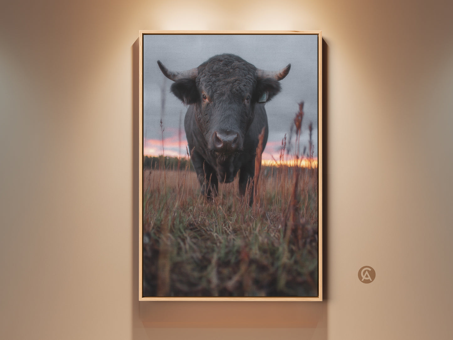 Rustic bull wall art in a farmhouse style. The canvas print captures wildlife animal decor. A bedroom art piece with a rustic gift idea. The bull stands in a field at sunset. Earthy tones enhance this traditional farm art.