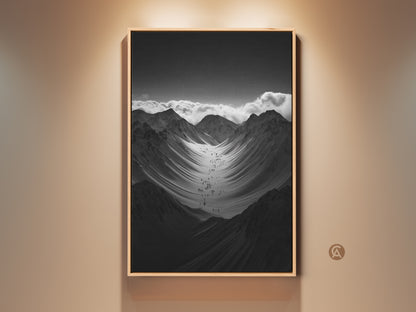Modern monochrome mountain art print displayed in a floating frame. A group of hikers are ascending a vast snowy mountain range. It's a perfect gift for hikers and climbers. This nature scenery wall art adds adventure to any space.