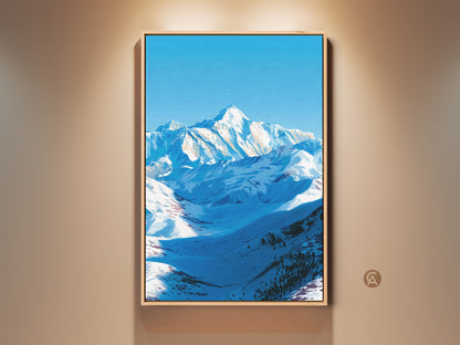 A framed canvas print of a snowy mountain landscape with a clear blue sky hangs on a beige wall. This modern nature artwork brings serene alpine scenery to any room. It is an ideal wall art for bedroom or office adding a touch of minimalist landscape art. A perfect gift for nature lovers seeking cool tone wall art.