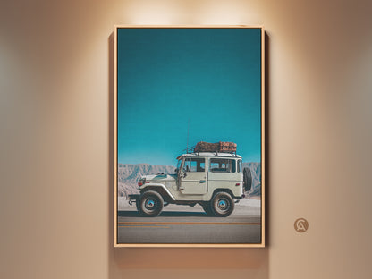 Vintage SUV wall art in a loft setting. This retro mountain landscape canvas print features a sky blue backdrop. The teal and off-white tones create adventure photography. Ideal industrial decor.