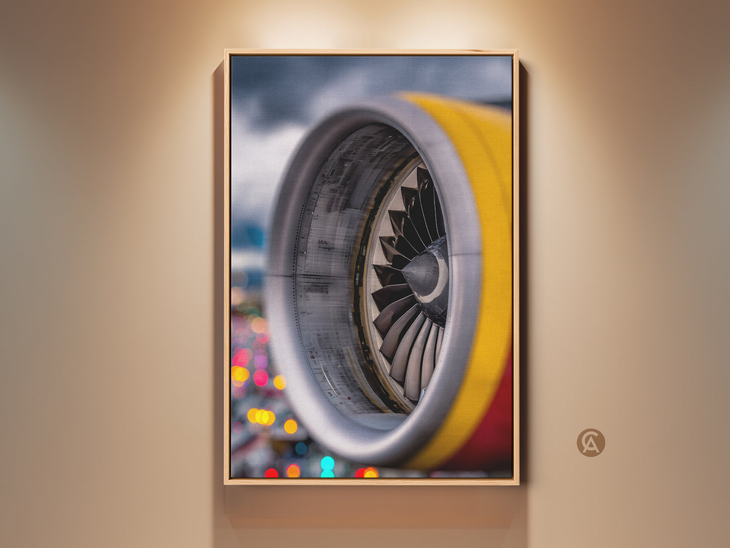 Industrial jet engine artwork is displayed in a wood frame. The aviation technology canvas features silver yellow and red abstract colors. This wall decor brings a loft-style aesthetic. It is a perfect office gift and a unique wall hanging.