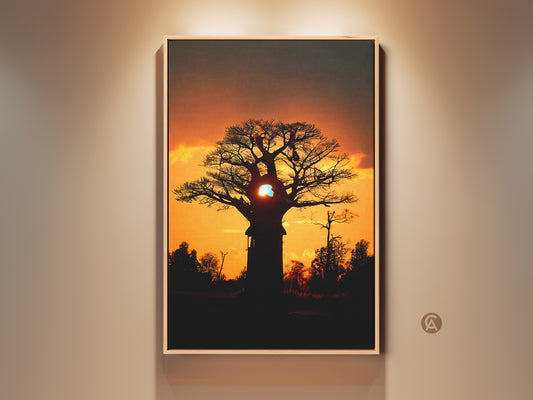 Framed African Sunset Baobab Tree art print. It is a boho landscape canvas wall decor. The orange and yellow nature artwork adds warmth to any bedroom. This travel themed decor brings the beauty of Africa indoors.