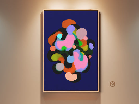 Modern abstract art print featuring organic shapes in indigo pink and green tones. This colorful artwork is framed and hung on a neutral wall. It is perfect for adding contemporary style to a bedroom or office wall decor. The art brings a playful energy to any space.