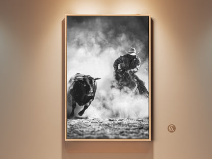 Monochrome Cowboy Art Print shows a Western bull riding scene. This grayscale rodeo wall art is perfect man cave decor. It makes a rustic home gift. This piece captures the thrilling action of bull riding. It brings cowboy spirit to your space.