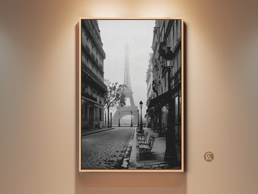 Monochrome Paris art print showcases the Eiffel Tower. A vintage cobblestone street leads to the iconic landmark. It's a contemporary French home decor gift idea. Black white cityscape art provides elegant entry hall wall art.