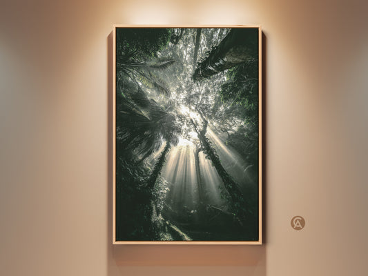 Photorealistic emerald forest canvas print. Sunbeams stream through deep green tropical foliage. This boho nature home decor brings an atmospheric jungle artwork to any space. Perfect as a nature lover housewarming gift.