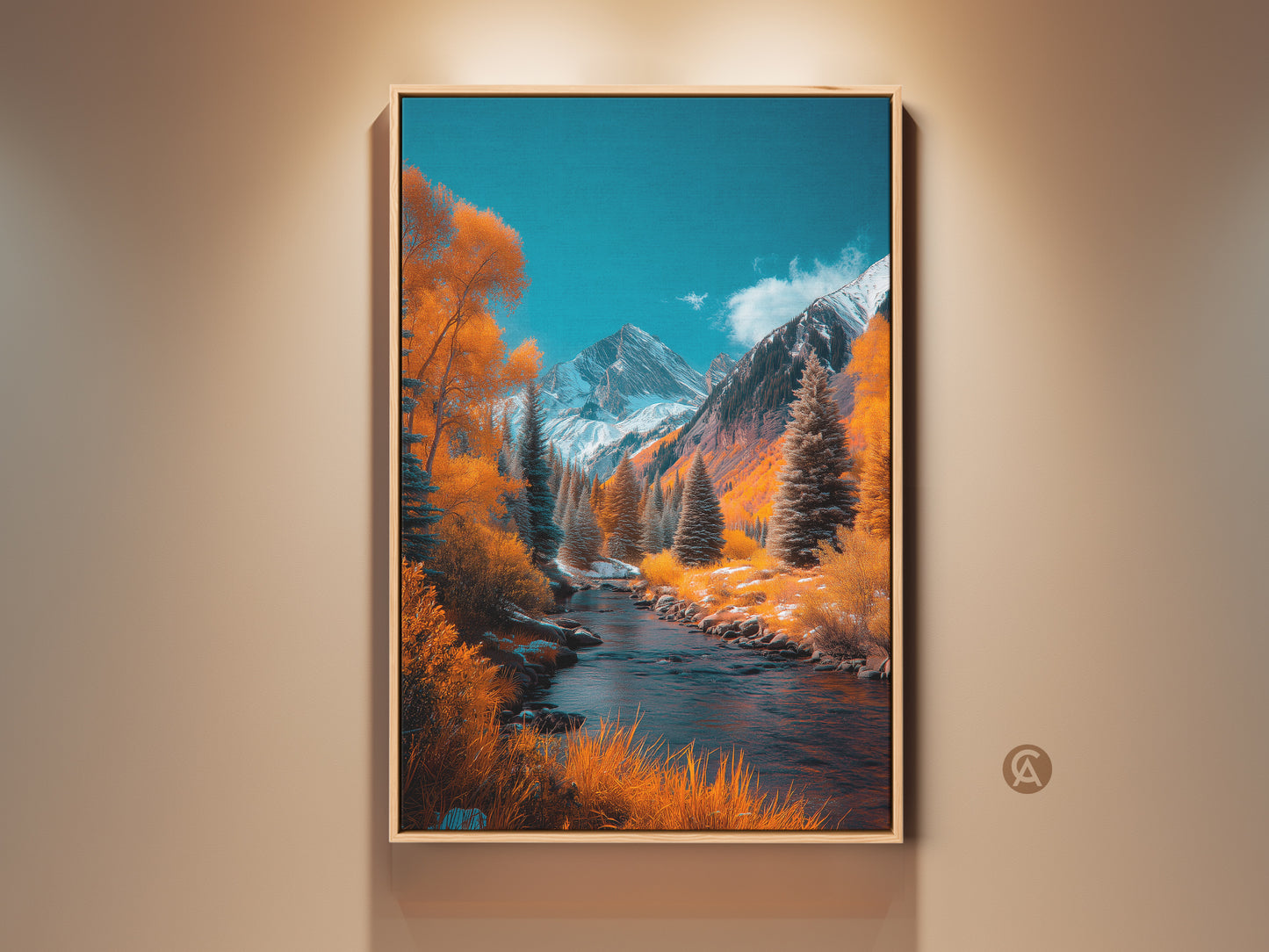 Framed landscape painting featuring a river flowing through a valley. Snow-capped mountains in the background create a serene and majestic scene. Warm colors of fall foliage contrast with the cool blue sky. This framed art piece is ready to hang adding natural beauty to any space.