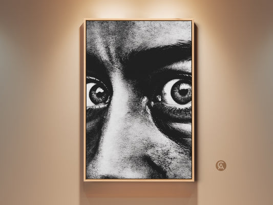 Monochrome face portrait canvas print in a wooden frame. The intense black and white eyes art creates a contemporary expression. This artwork enhances entryway or living room wall decor. A perfect gift for art lovers. The dramatic eyes canvas adds a bold touch to any modern home office.