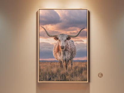 Framed Texas Longhorn canvas art brings rustic charm. This wildlife artwork features a photorealistic longhorn against a savanna sunset. Perfect western farmhouse decor wall hanging for animal lovers. Add a touch of ranch style to your home with this beautiful print.