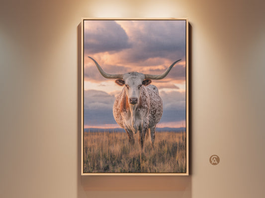 Framed Texas Longhorn canvas art brings rustic charm. This wildlife artwork features a photorealistic longhorn against a savanna sunset. Perfect western farmhouse decor wall hanging for animal lovers. Add a touch of ranch style to your home with this beautiful print.