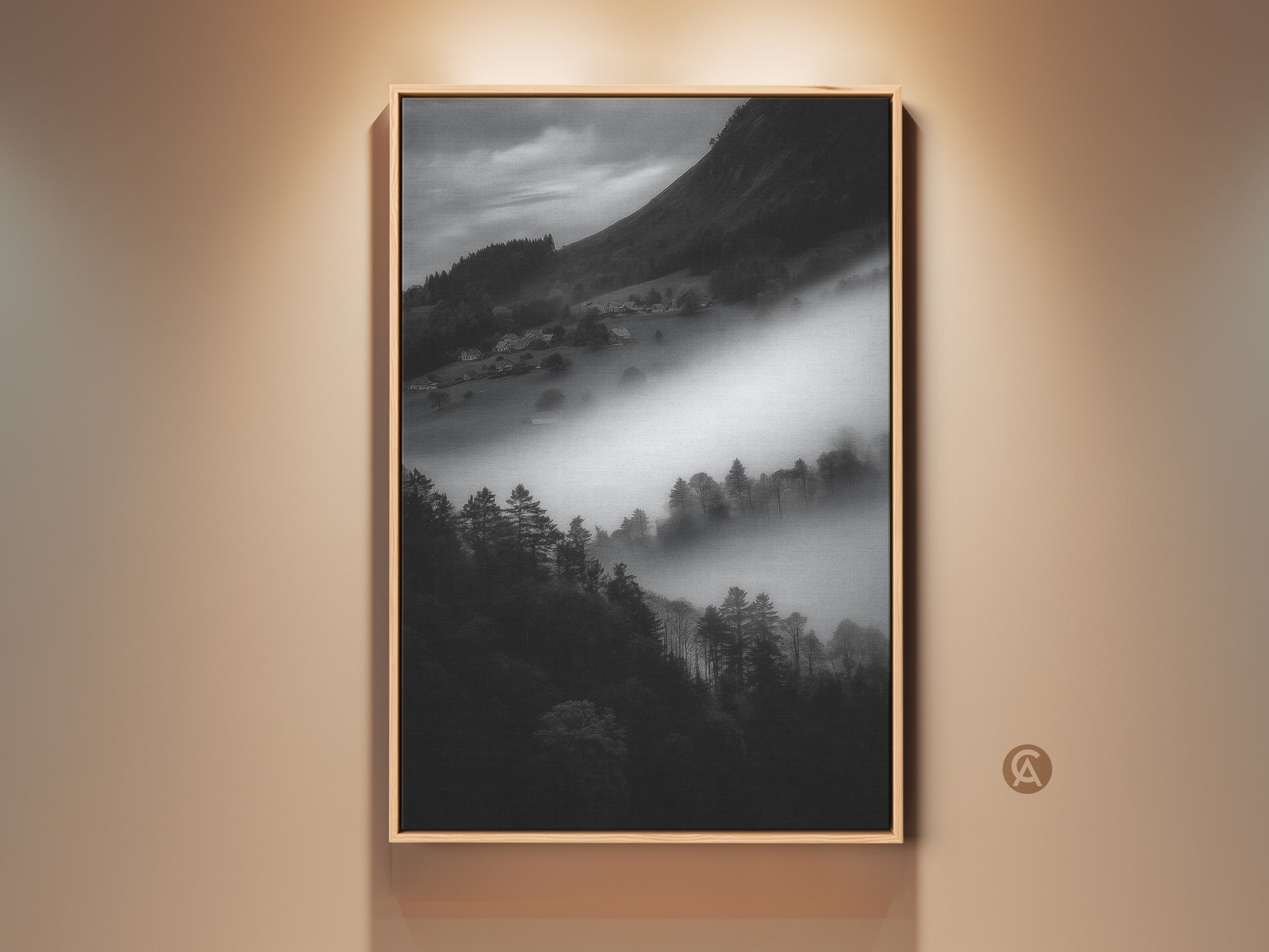 Framed black and white mountain art print. This monochrome landscape canvas wall art captures a foggy village scene. Contemporary nature scene decor makes a perfect housewarming gift. The black frame enhances the neutral wall art.