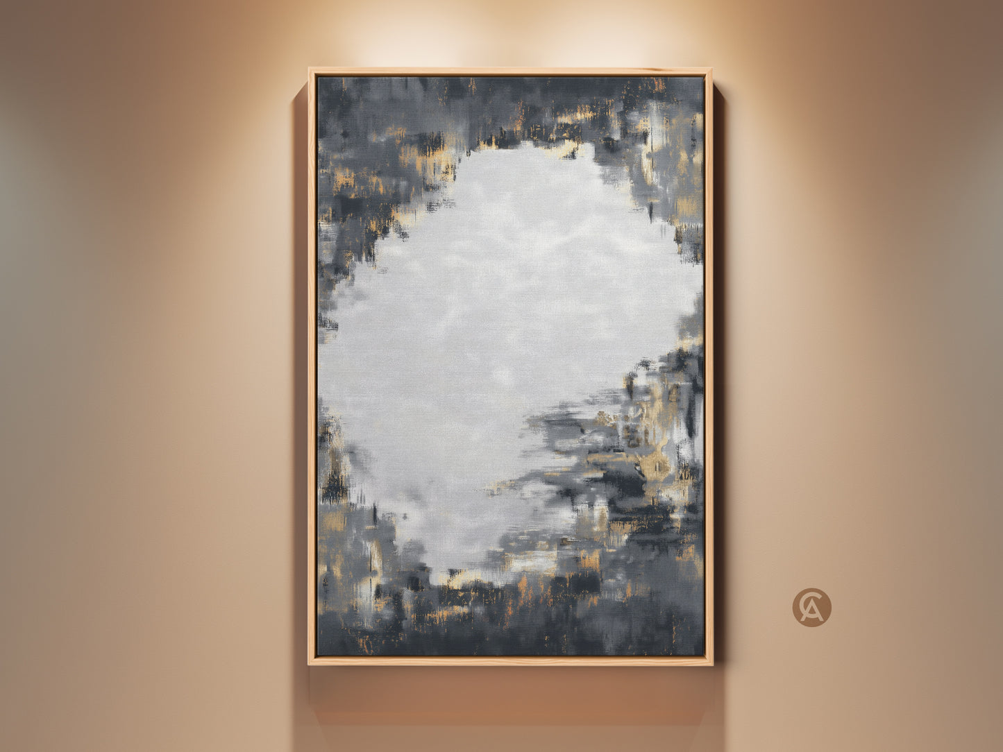 Framed charcoal grey and gold abstract artwork hangs on a neutral wall. This contemporary canvas art features textured brushstrokes. It's perfect for adding a sophisticated touch to a living room or office. The neutral color palette complements various decor styles making it a versatile piece.