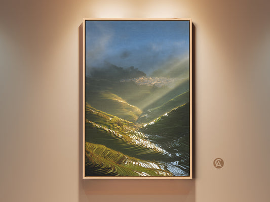 Framed Photorealistic Terrace Fields Canvas Print featuring golden sunbeams. A village scene and blue green landscape art enhance modern farmhouse wall decor. This cinematic artwork brings tranquility to any room.