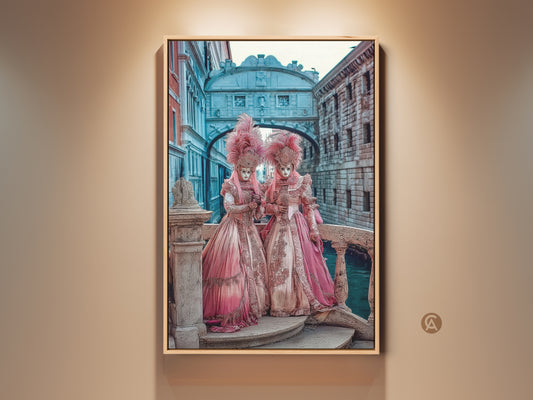 Baroque Venetian Carnival Art Print features regal masked figures. The wall art showcases a pink gold teal aesthetic. The art is set against an iconic bridge. An eclectic home decor gift idea for lovers of historical venetian artwork.