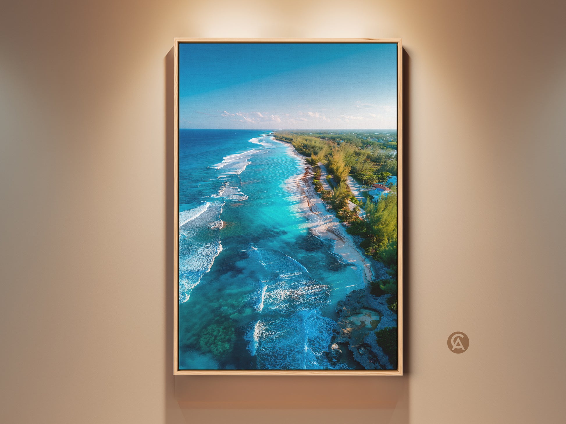 Framed canvas art featuring a vibrant aerial beach scene. The artwork showcases turquoise waters meeting a sandy shore. Green trees line the coast under a clear blue sky. This beach art piece adds a tranquil touch to any room. Ready to hang and enjoy.