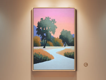 Framed abstract landscape art print on a wall. The contemporary artwork features a path under a pink orange sky. Trees add a touch of nature to the modern bedroom decor. This art piece is a stylish addition to any living space. Modern nature canvas.