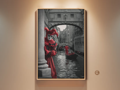 Capture the Venice Carnival spirit with this canvas art print. It shows a theatrical jester in a red costume peeking behind a pillar. See the gondola and Venetian architecture. This artwork adds eclectic charm to any room. A perfect travel to Venice gift.