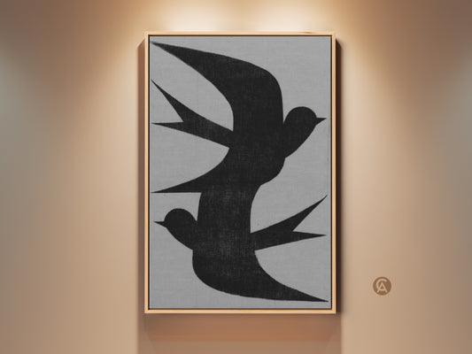Framed minimalist wall art featuring an abstract black swallow flock. The charcoal artwork is a canvas print. This modern grey nature decor is for bedroom wall hanging art. Consider this housewarming gift canvas for minimalist home decor. This abstract artwork of birds will create a neutral bedroom aesthetic.