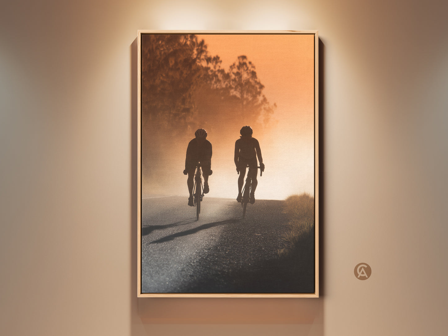 Road cyclist silhouette canvas print. This sport wall decor features an amber sunset landscape. Perfect modern hallway art. It makes a thoughtful gift for cyclists. The warm colors enhance any room.