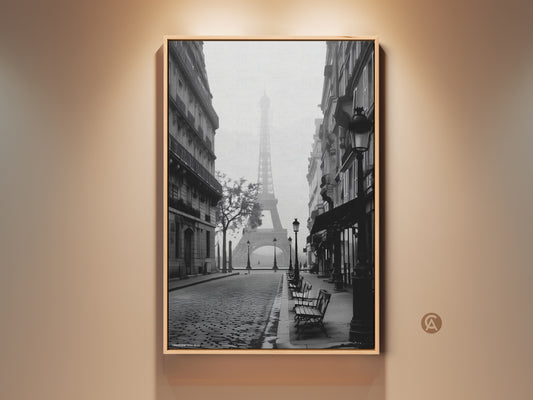 Eiffel Tower art print showcases a monochrome Paris street. Vintage cobblestone enhances the black and white Parisian decor. This framed canvas adds European elegance to any room. It's ideal for travel enthusiasts and those who appreciate fine art. Display architectural wall art with a chic French flair.