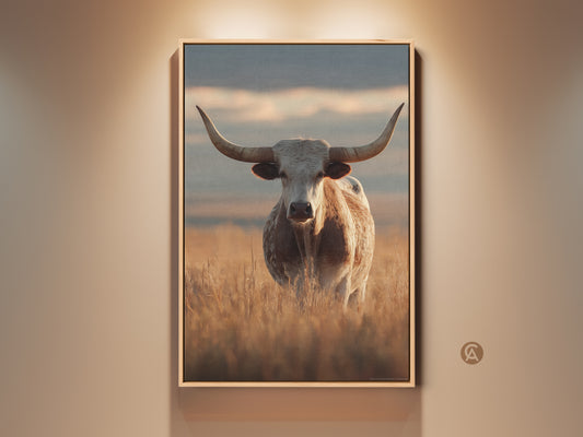 Rustic longhorn cattle canvas artwork in a farmhouse style. The animal print features goldenrod and beige hues evoking a Tuscan landscape. This photorealistic wildlife art enhances any country living room or western ranch decor.