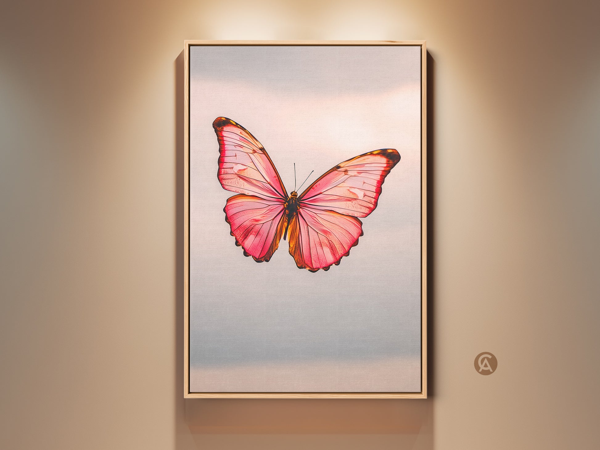 Framed minimalist butterfly art print in a room setting. The modern nature insect artwork features a pink peach and rose gold canvas. It's a bedroom office gift idea. The delicate butterfly art is a beautiful wall decor piece.