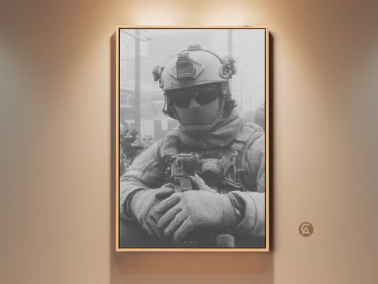 Framed canvas artwork featuring a soldier in tactical gear. The black and white art print captures the intensity of military life. Ready to hang this piece adds a touch of valor to any room.